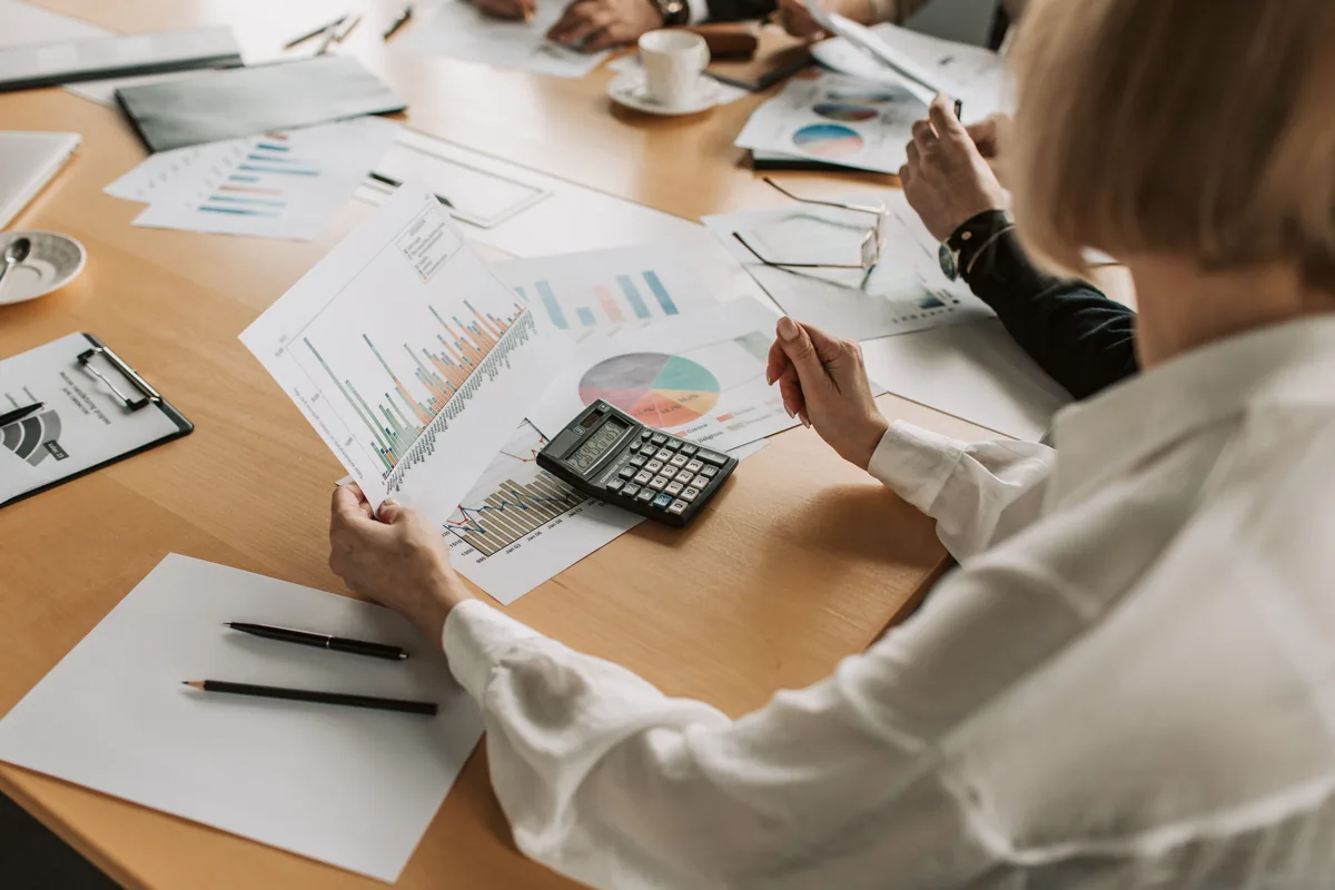 Professionals reviewing reports and financial information