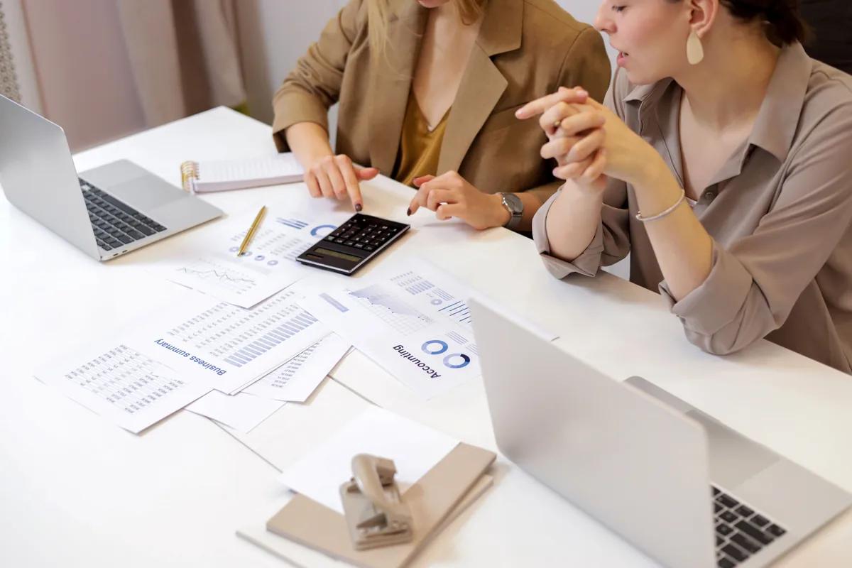 Professionals reviewing financial records and calculations